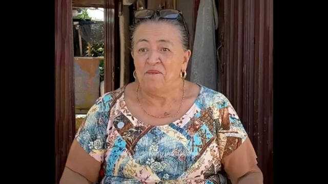 67-year-old Colombian woman makes money selling neighbourhood gossip; she carries a notebook, collects evidence, also takes payment to keep her mouth shut